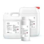 White plastic chemical containers with red cap and label visible, indicating large packaging for a product (storage/handling context)